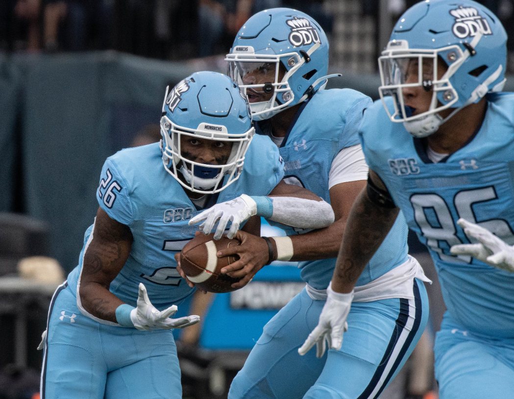 ODU Monarchs backfield handoff in sky blue uniforms