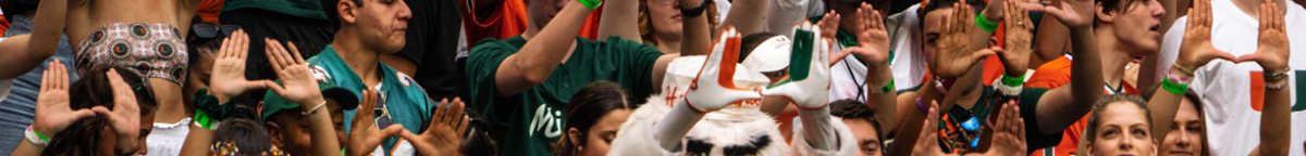 Miami Hurricanes crowd throwing the U with the mascot at a football game