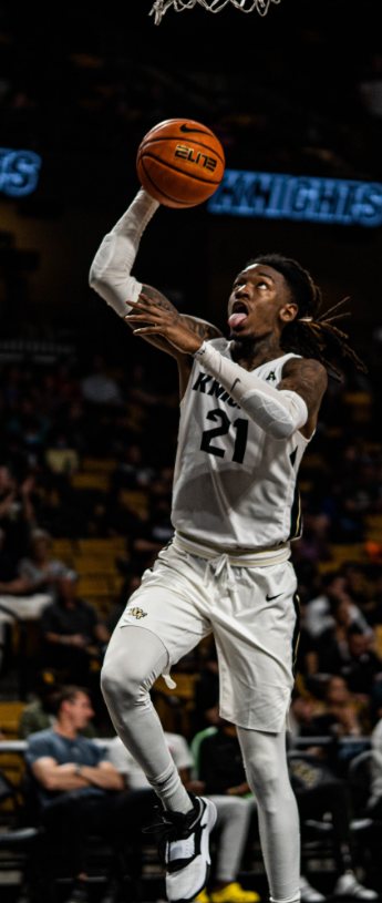 UCF Knights number 21 rising for a layup under the rim