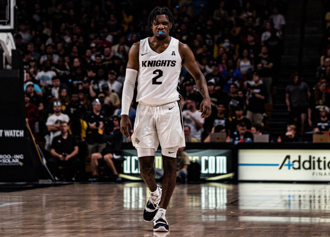 UCF Knights guard number 2 walking up court in front of the home crowd