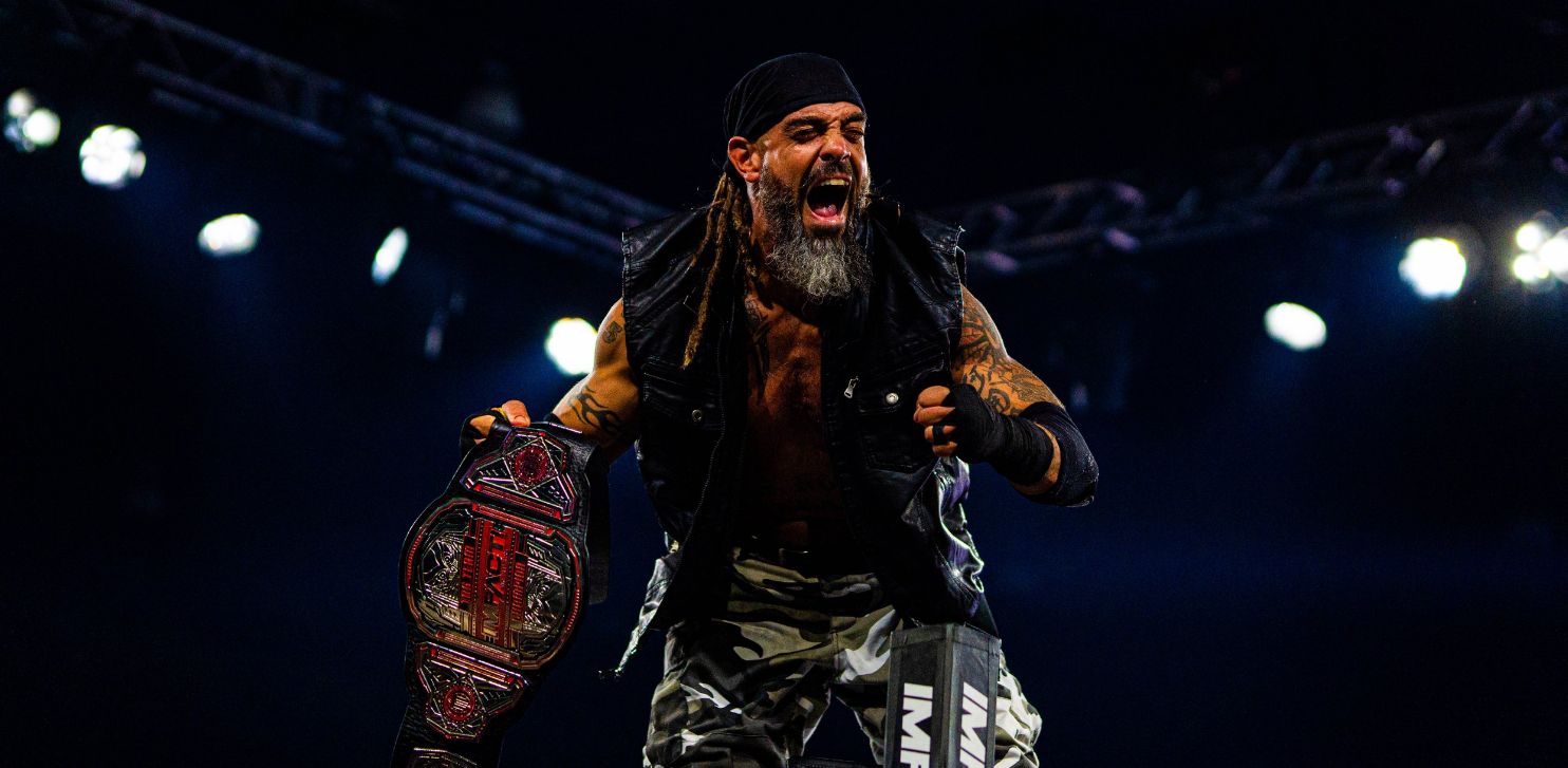 IMPACT Wrestling champion shouting and holding his title belt